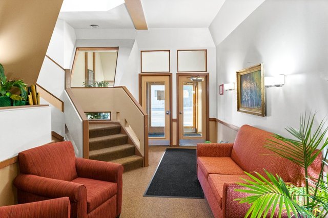 6337 Roosevelt Road, Unit 103 Berwyn, IL 60402 - Photo 3 of 14 a living room with furniture and a large window