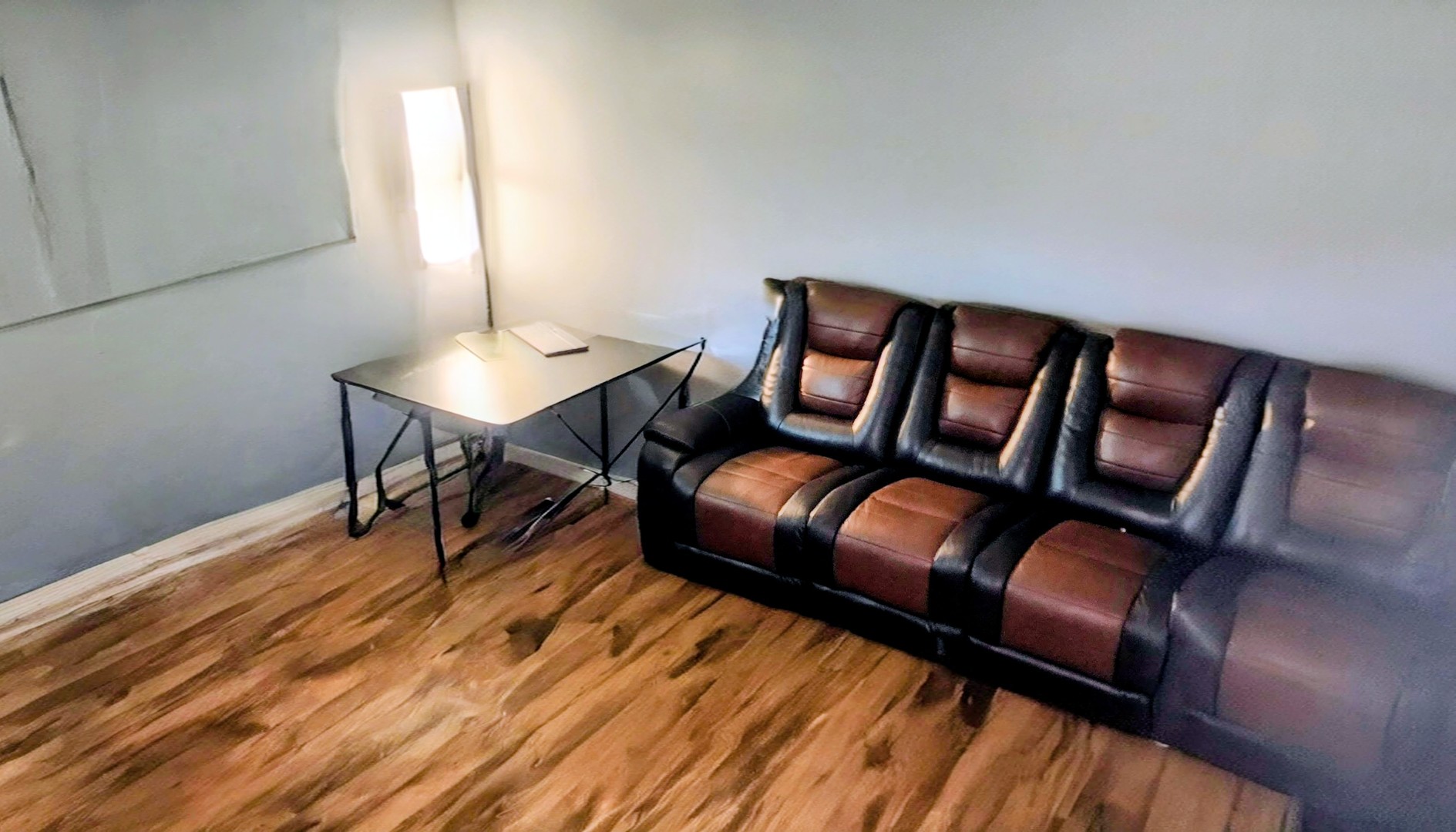 6337 Roosevelt Road, Unit 103 Berwyn, IL 60402 - Photo 9 of 14 a living room with furniture and wooden floor
