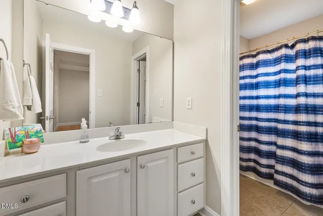 a bathroom with a sink a vanity and a mirror