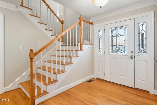 a view of an entryway with wooden floor