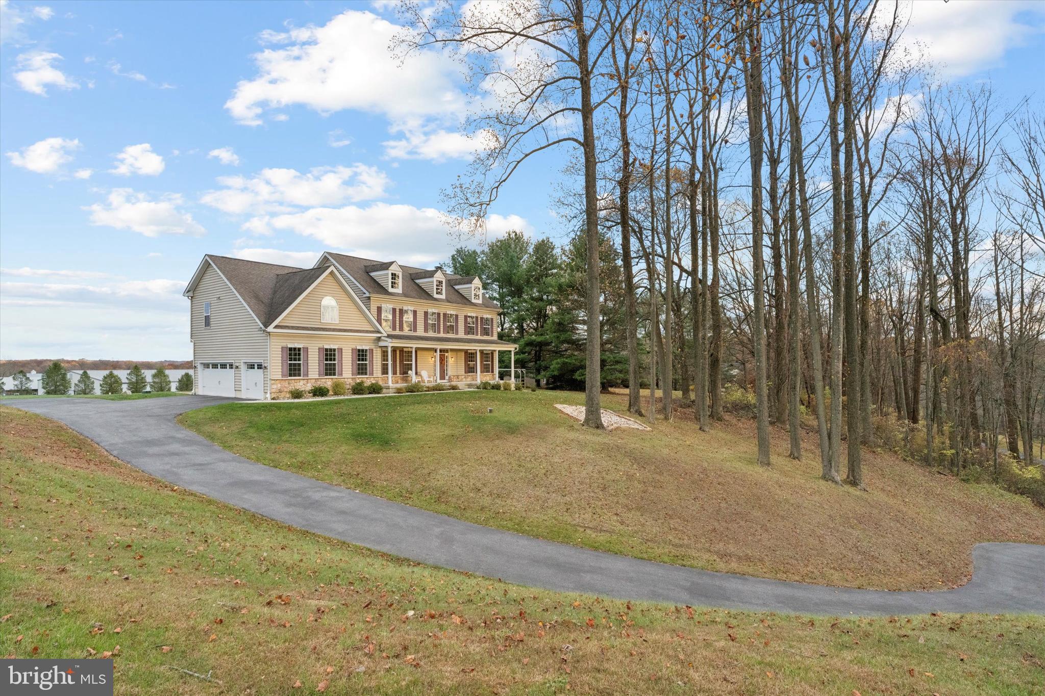1392 Hickory Hill Road Chadds Ford, PA 19317 - Photo 2 of 35 a view of a large house with a big yard and large trees