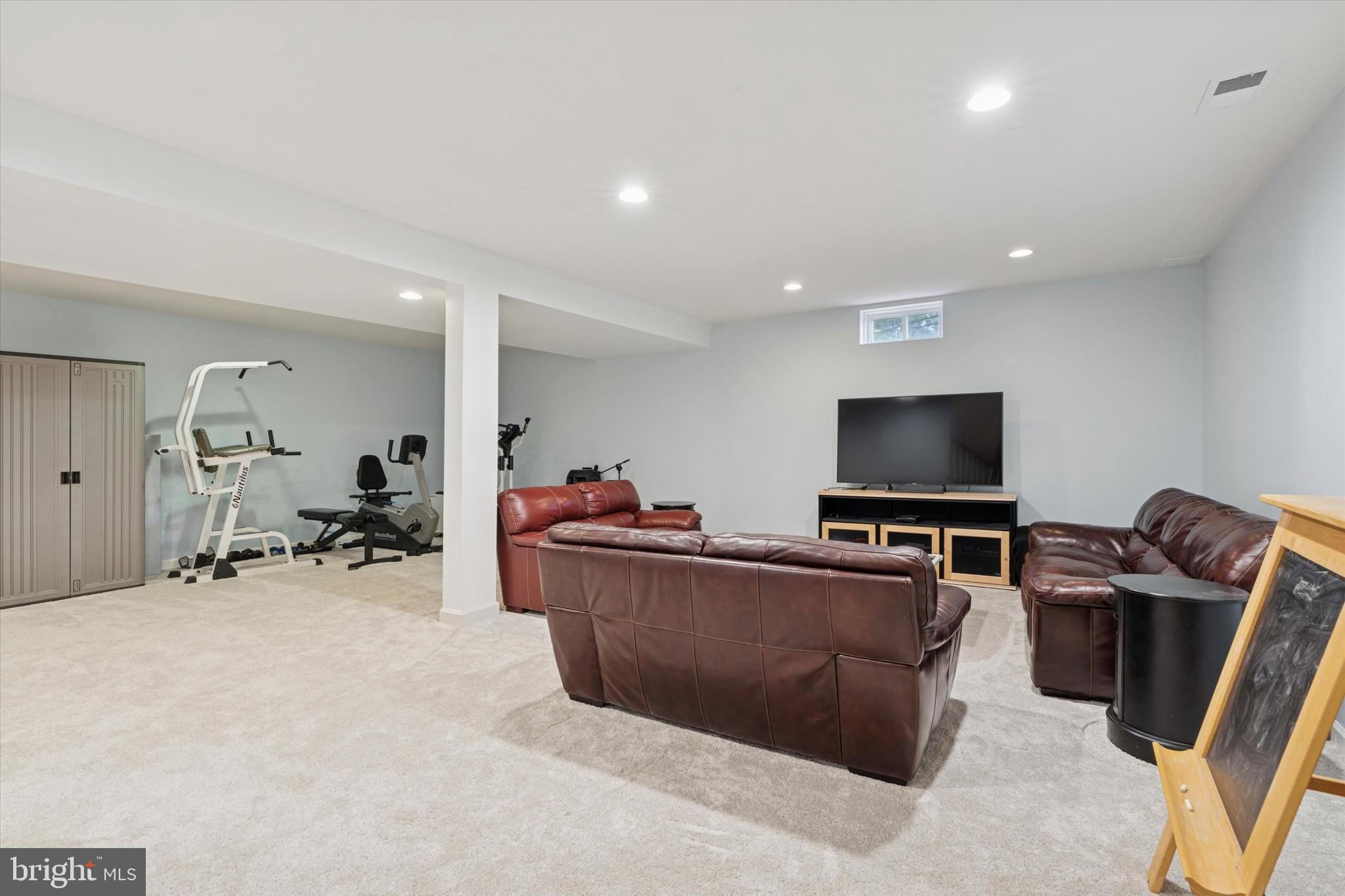 1392 Hickory Hill Road Chadds Ford, PA 19317 - Photo 26 of 35 a living room with furniture and a flat screen tv