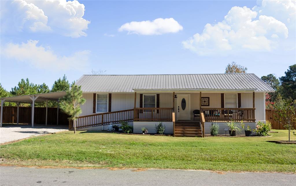 214 County Road 2147 Quitman, TX 75783 - Photo 1 of 38 front view of a house with a patio