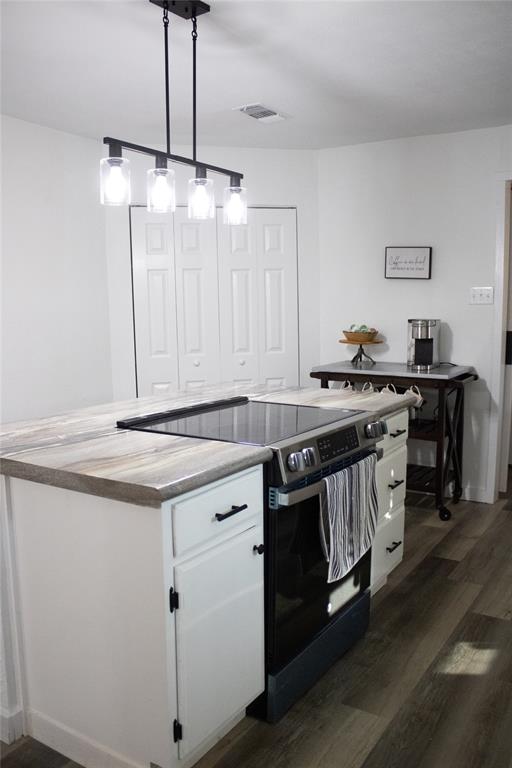 214 County Road 2147 Quitman, TX 75783 - Photo 16 of 38 a kitchen with a sink a stove and a refrigerator