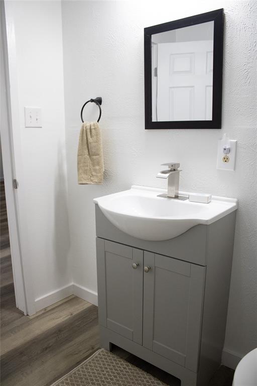 214 County Road 2147 Quitman, TX 75783 - Photo 22 of 38 a bathroom with a sink a mirror and vanity