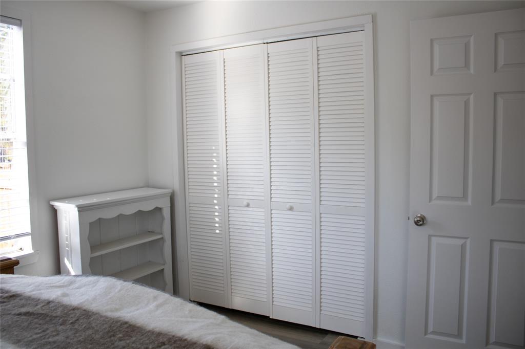 214 County Road 2147 Quitman, TX 75783 - Photo 24 of 38 a bedroom with a white bed and a white cabinet