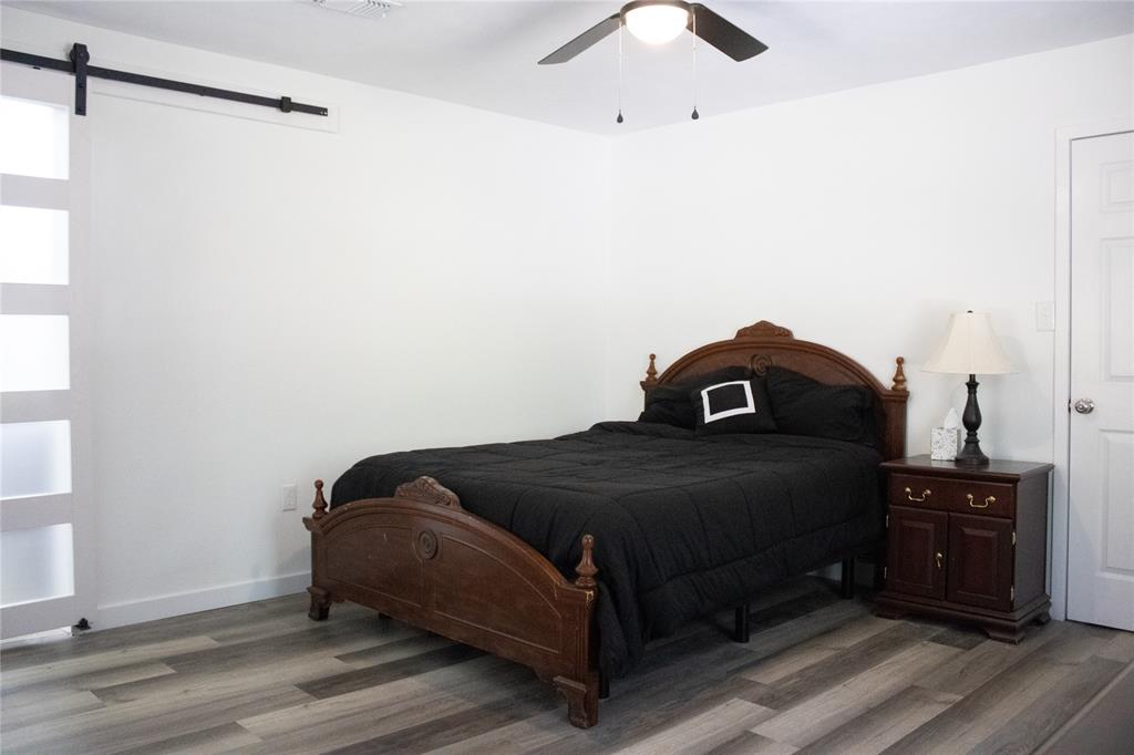 214 County Road 2147 Quitman, TX 75783 - Photo 26 of 38 a bedroom with a bed and a cabinets