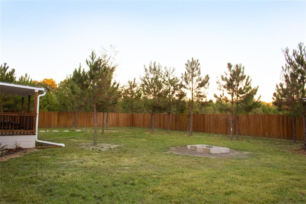 214 County Road 2147 Quitman, TX 75783 - Photo 31 of 38 a view of a backyard with a slide