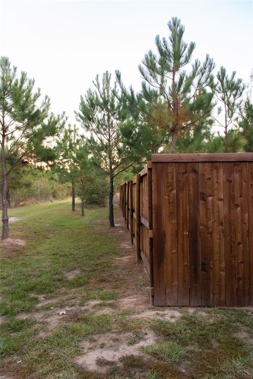 214 County Road 2147 Quitman, TX 75783 - Photo 37 of 38 a view of outdoor space with wooden fence