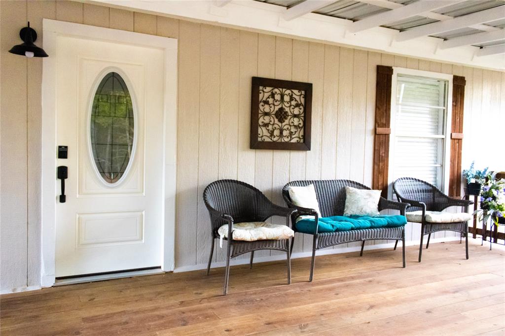 214 County Road 2147 Quitman, TX 75783 - Photo 6 of 38 a living room with furniture and a painting on the wall