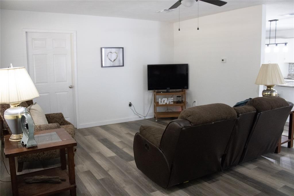 214 County Road 2147 Quitman, TX 75783 - Photo 9 of 38 a living room with furniture and a flat screen tv