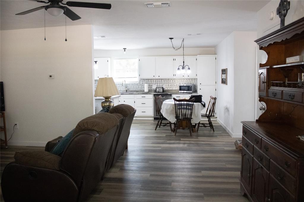 214 County Road 2147 Quitman, TX 75783 - Photo 10 of 38 a living room with furniture and a chandelier