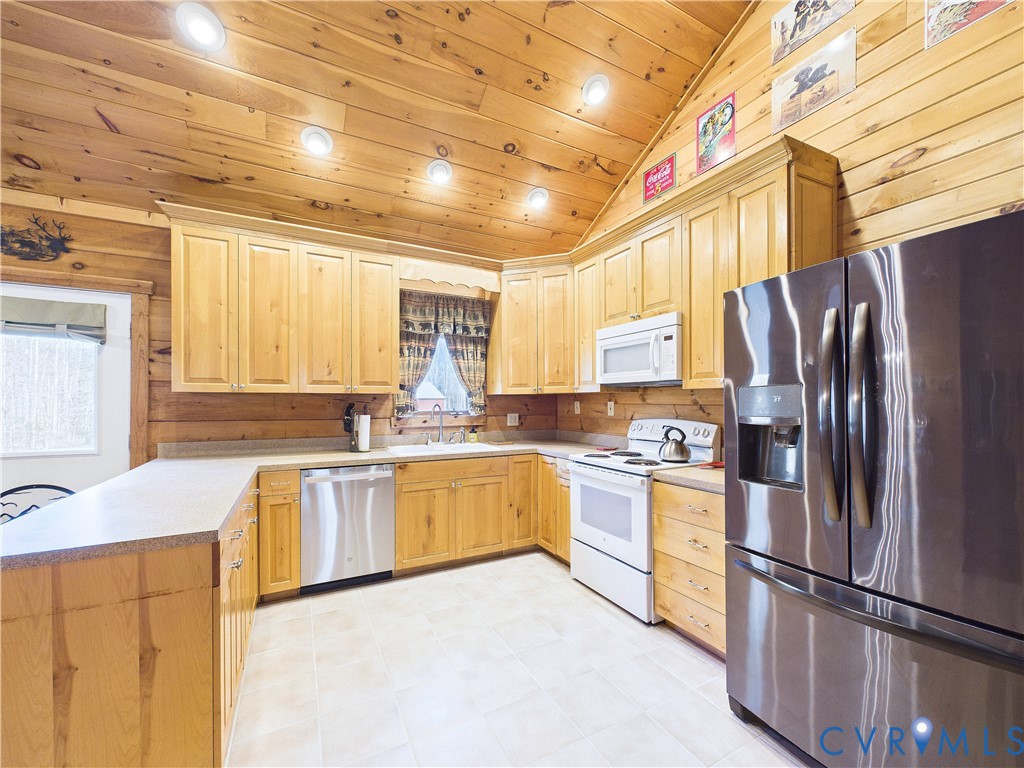 469 Jenkins Church Road Cumberland, VA 23040 - Photo 5 of 40 a kitchen with stainless steel appliances granite countertop a refrigerator a stove a sink dishwasher and a refrigerator