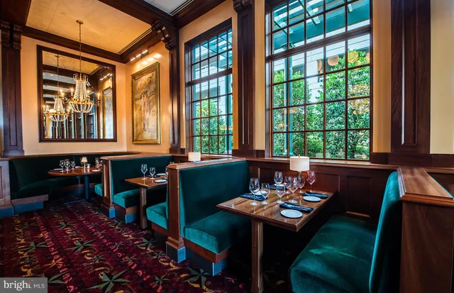 a view of a dining room with furniture window and outside view