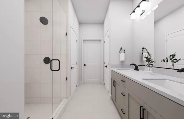 a spacious bathroom with a double vanity sink mirror and