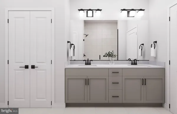 a bathroom with a double vanity sink and a mirror