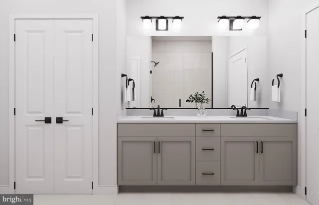 a bathroom with a double vanity sink and a mirror