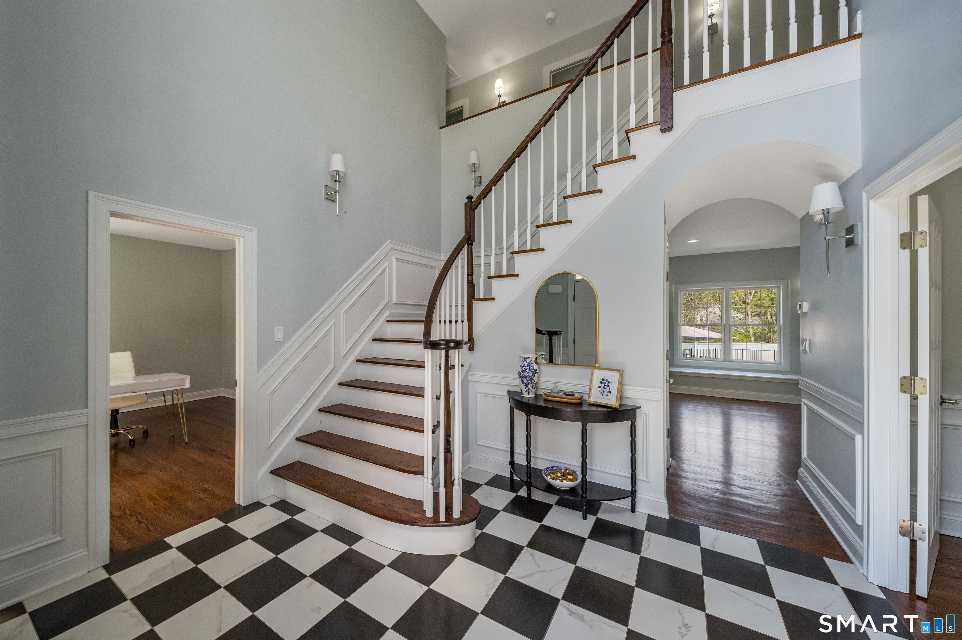 9 Sunset Ridge Drive Guilford, CT 06437 - Photo 4 of 40 a view of a hallway with a black and white checkered floor