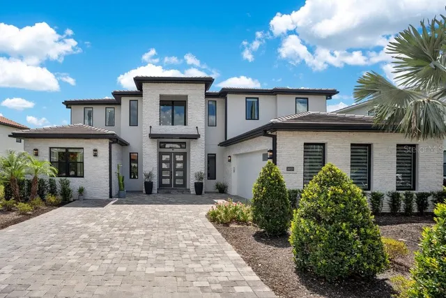 an aerial view of swimming pool with outdoor seating