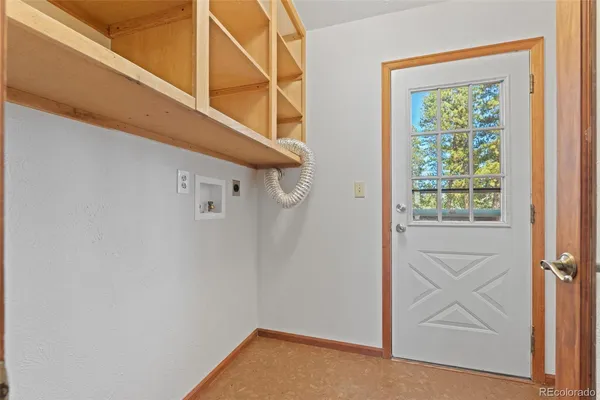 a view of balcony with wooden floor and outdoor seating