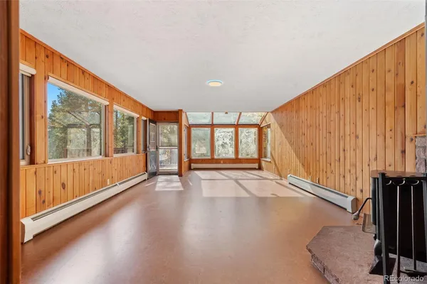 a view of an entryway with wooden floor
