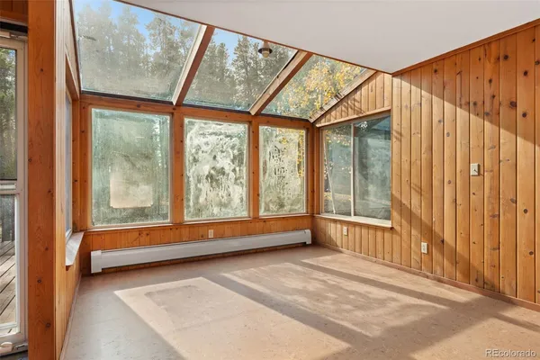 a view of room with window and air conditioner