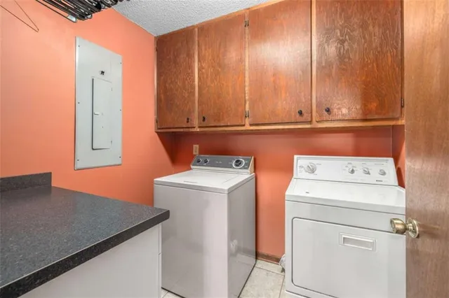a view of storage and utility room with washer and dryer