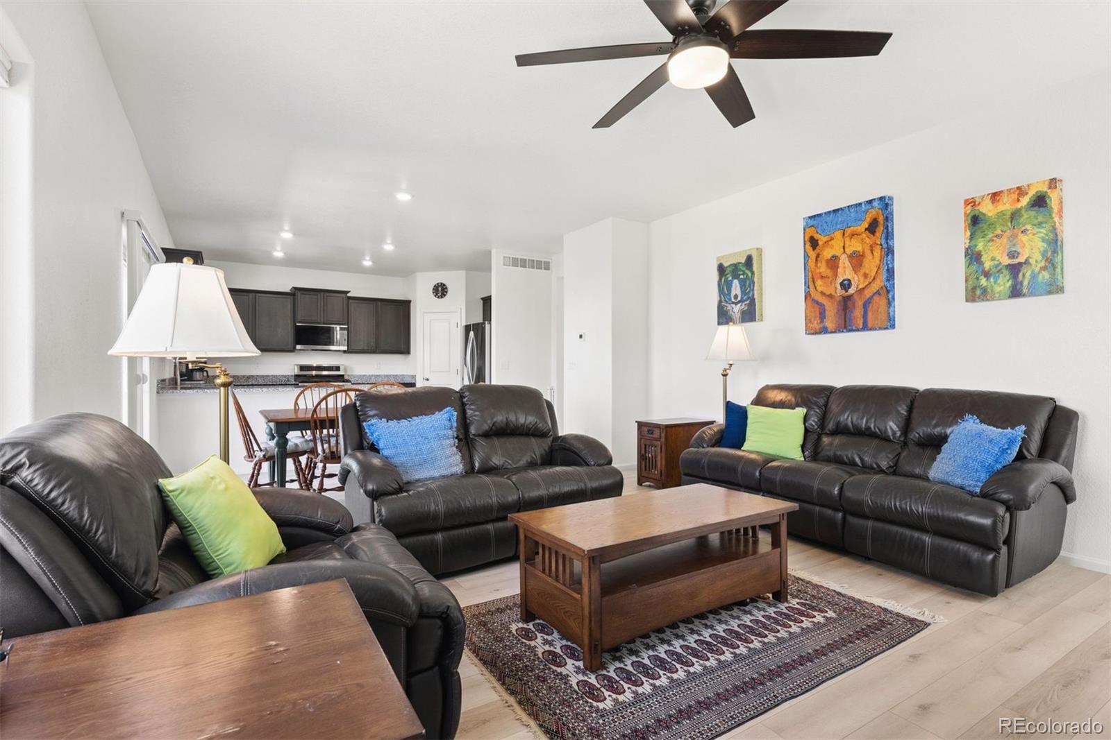 7307 Animas Avenue Frederick, CO 80530 - Photo 14 of 49 a living room with furniture ceiling fan and a rug