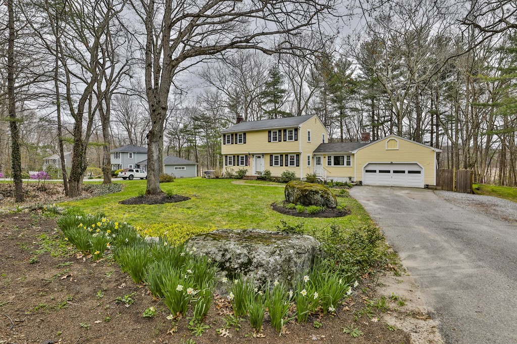 93 Teele Road Bolton, MA 01740 - Photo 1 of 40 a front view of a house with a yard and trees