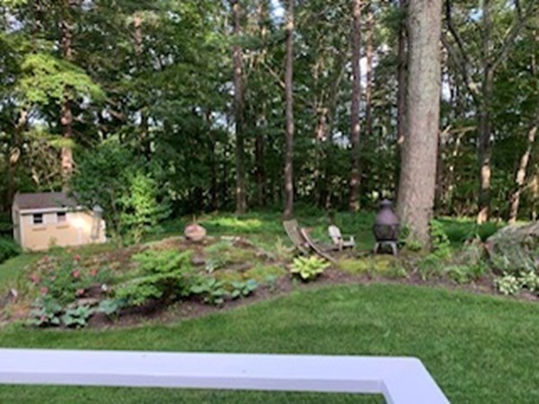 93 Teele Road Bolton, MA 01740 - Photo 11 of 40 a view of a backyard with plants and garden