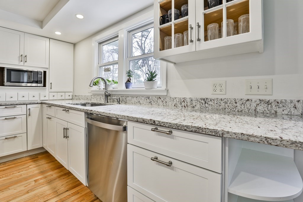 93 Teele Road Bolton, MA 01740 - Photo 16 of 40 a kitchen with stainless steel appliances granite countertop a sink stove and cabinets