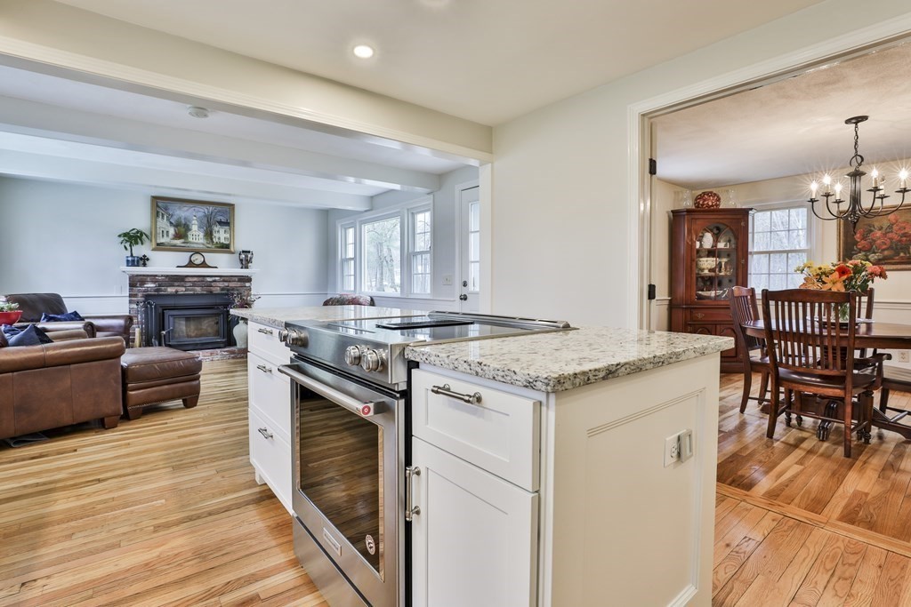 93 Teele Road Bolton, MA 01740 - Photo 18 of 40 a kitchen with a stove and a wooden floor