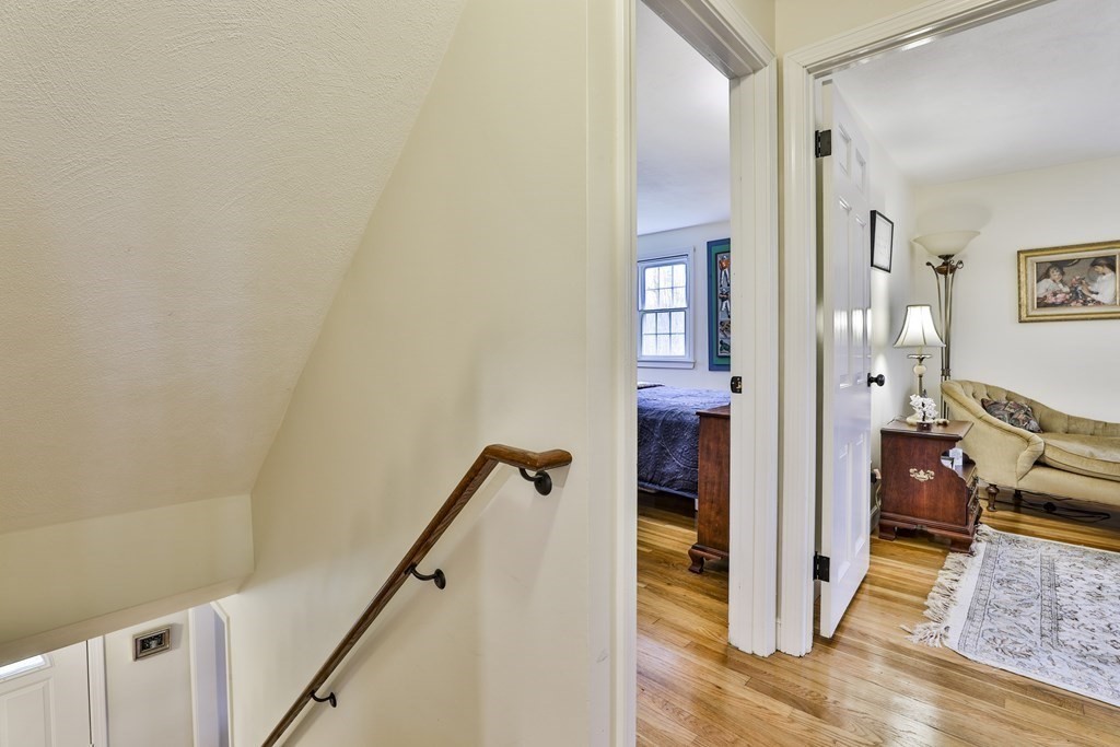 93 Teele Road Bolton, MA 01740 - Photo 30 of 40 a view of a hallway with wooden floor and workspace