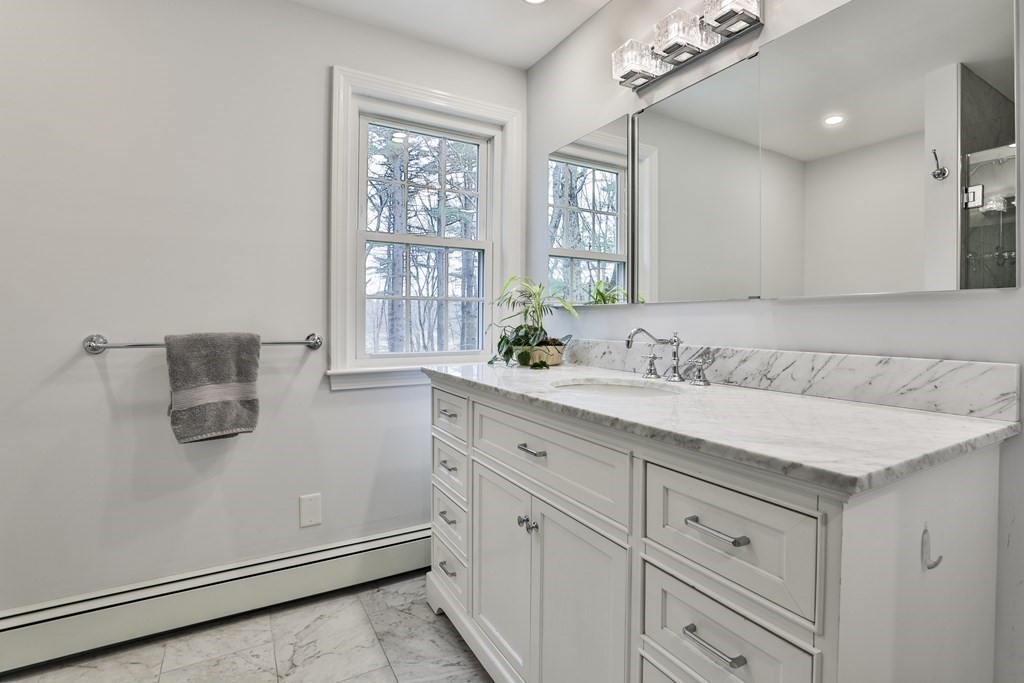 93 Teele Road Bolton, MA 01740 - Photo 38 of 40 a bathroom with a sink and a mirror