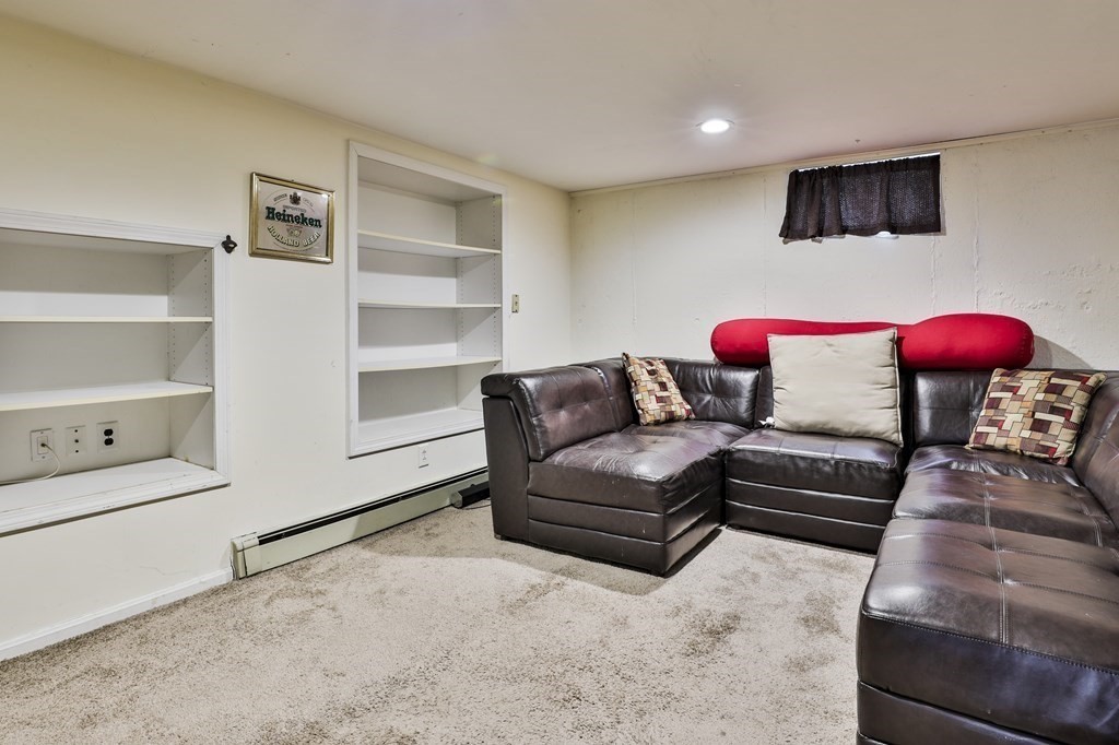 93 Teele Road Bolton, MA 01740 - Photo 40 of 40 a living room with furniture and a flat screen tv