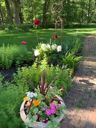 93 Teele Road Bolton, MA 01740 - Photo 6 of 40 a yard with lots of flowers and trees