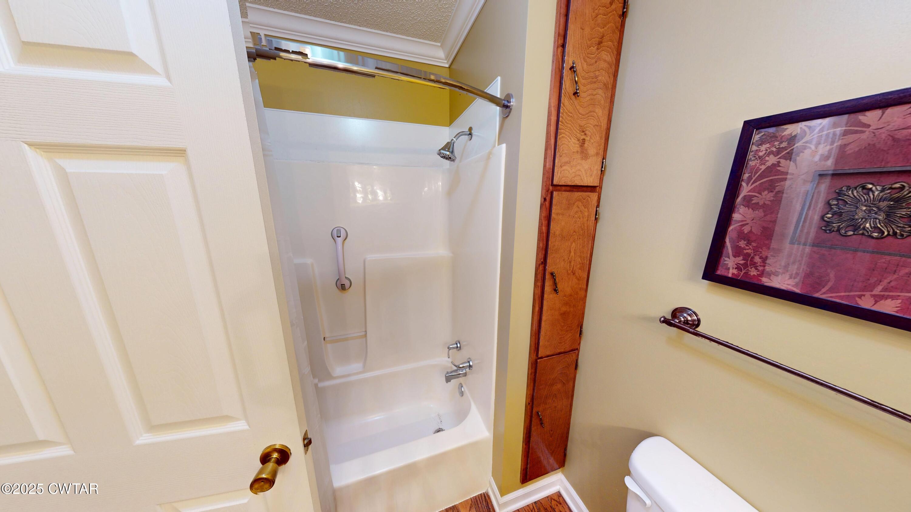4960 Upper Finley Road Dyersburg, TN 38024 - Photo 18 of 39 a bathroom with a tub and shower