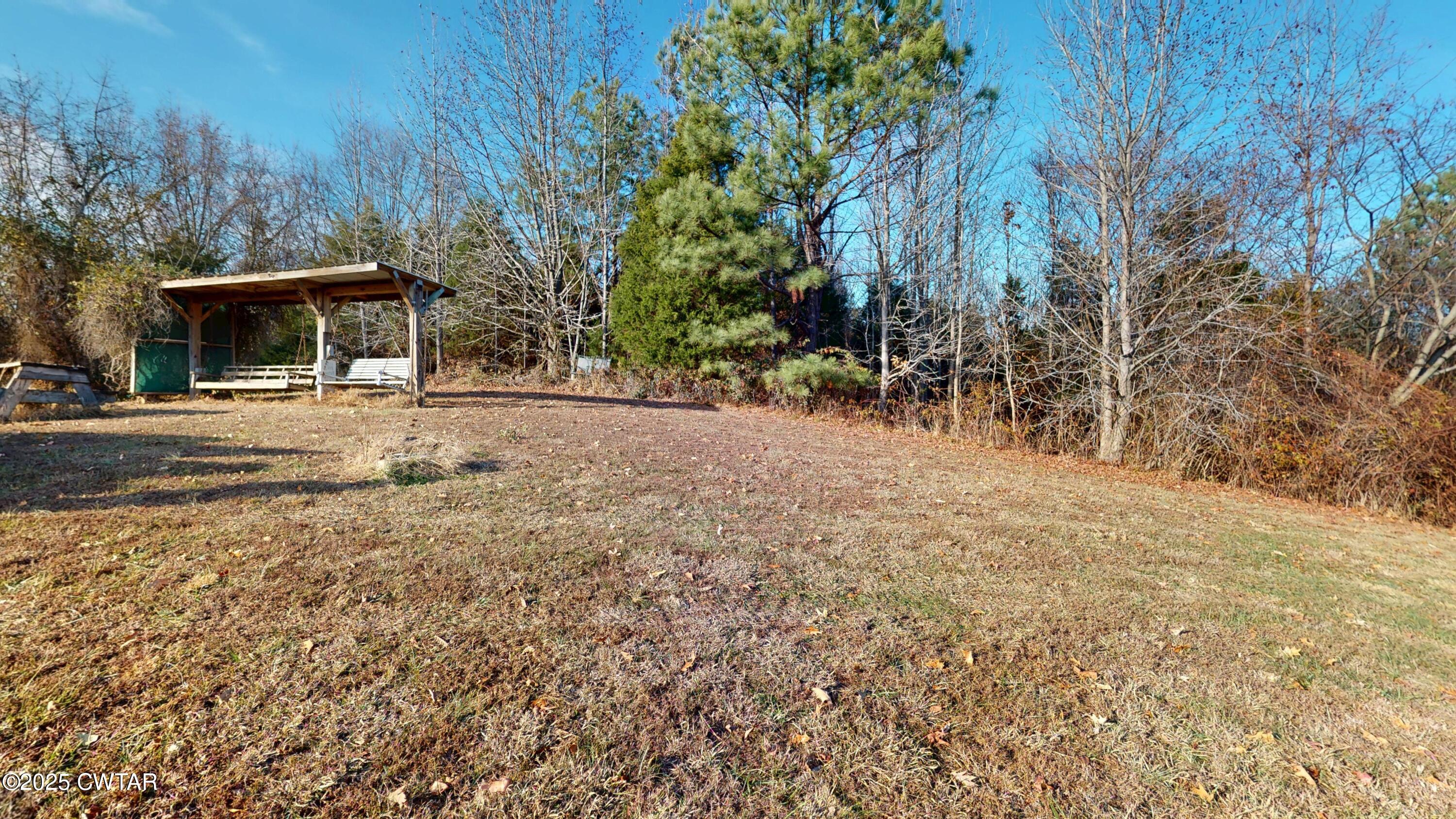 4960 Upper Finley Road Dyersburg, TN 38024 - Photo 25 of 39 a view of a house with a yard
