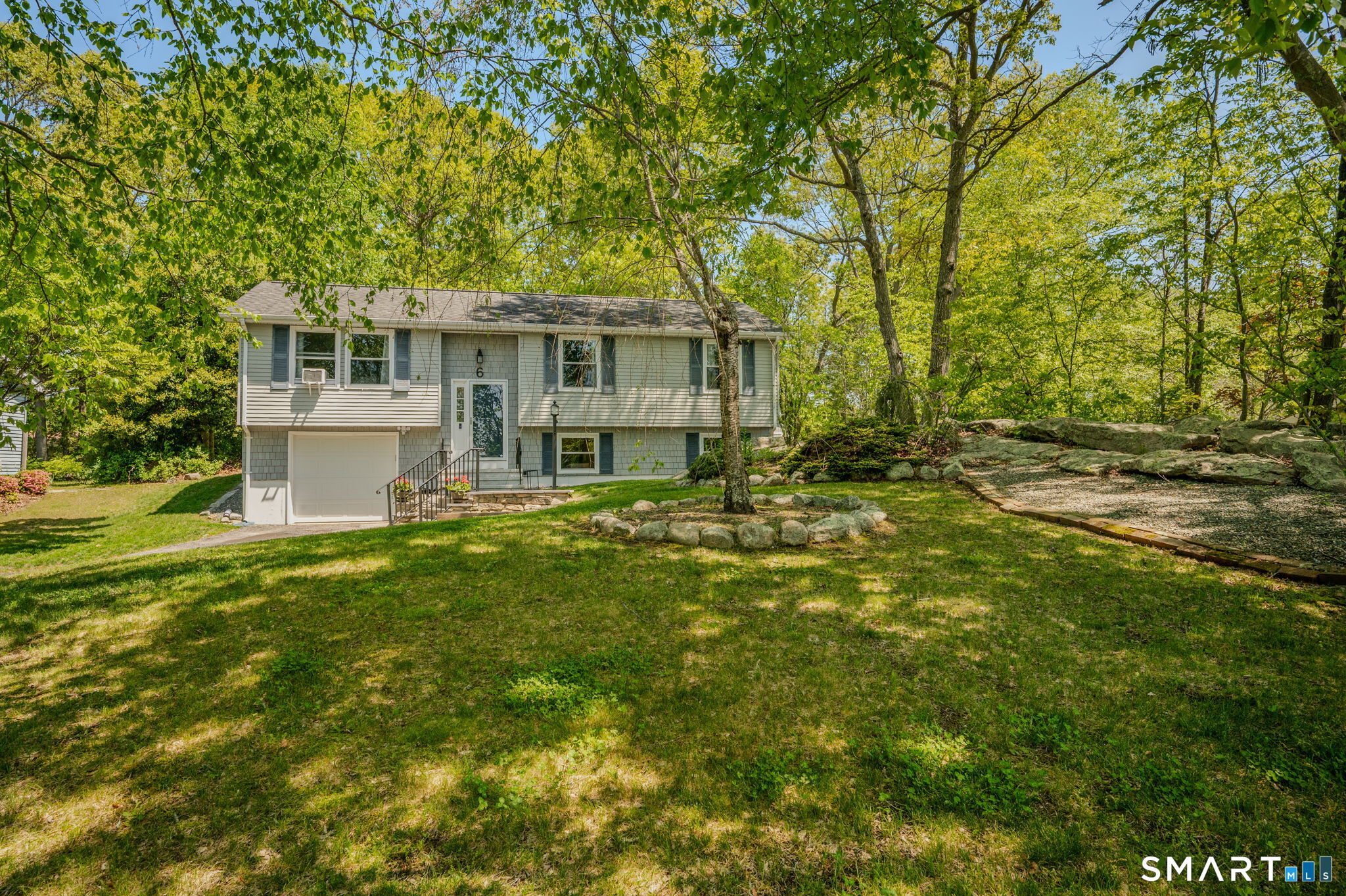 6 Amherst Court Groton, CT 06355 - Photo 4 of 40 a view of a house with a big yard and large trees