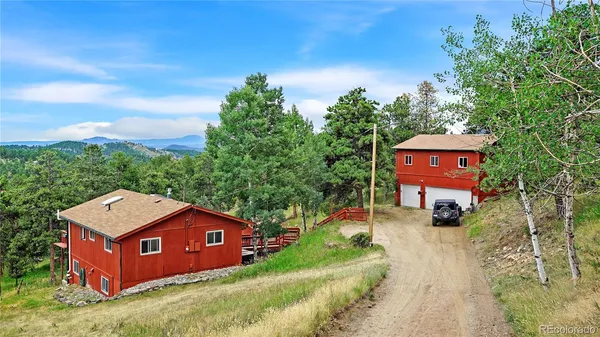 a pathway of a house with a yard