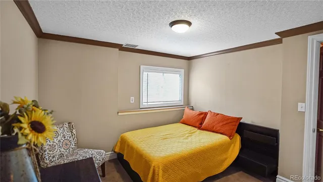 a bedroom with a bed and cabinets