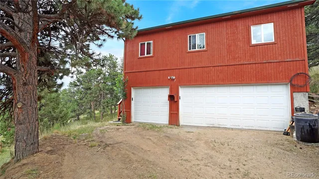 a view of an empty room with a fireplace