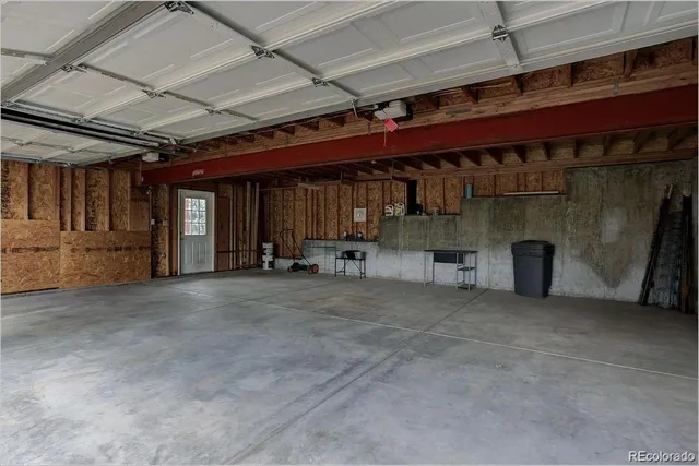 a view of an empty room with wooden walls