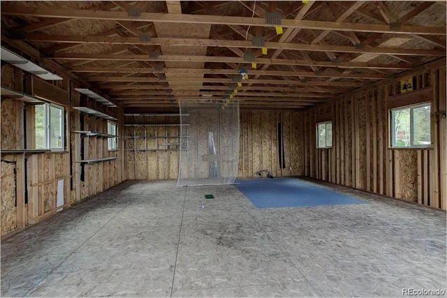 an aerial view of a house with outdoor space