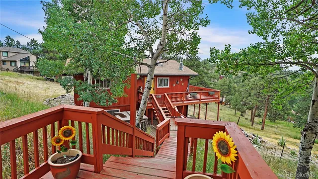 a view of a two chairs on the deck