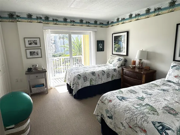 a bathroom with a granite countertop sink mirror and toilet