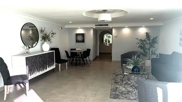 a view of a livingroom with furniture and a chandelier