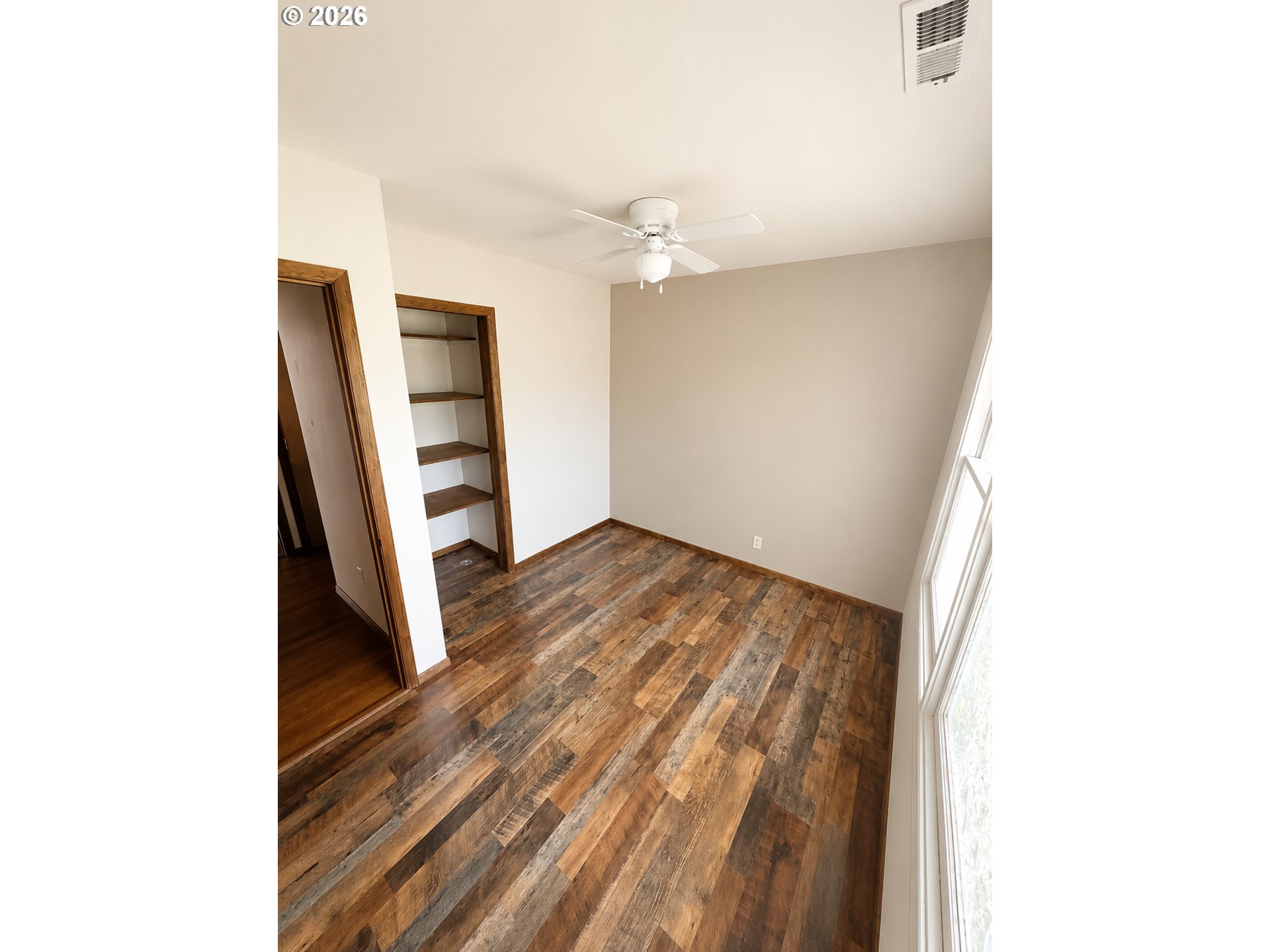 10 Southwest Peach Lane Winston, OR 97496 - Photo 14 of 22 a view of an empty room with wooden floor