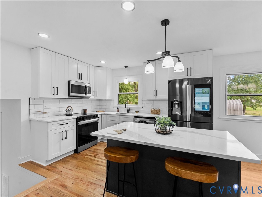 7361 Creek Ridge Road Henrico, VA 23231 - Photo 15 of 51 Kitchen featuring white cabinetry, stainless steel