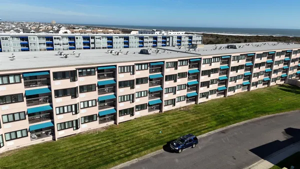 a view of building with yard